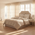 Neatly made bed with decorative pillows in a well-lit bedroom.