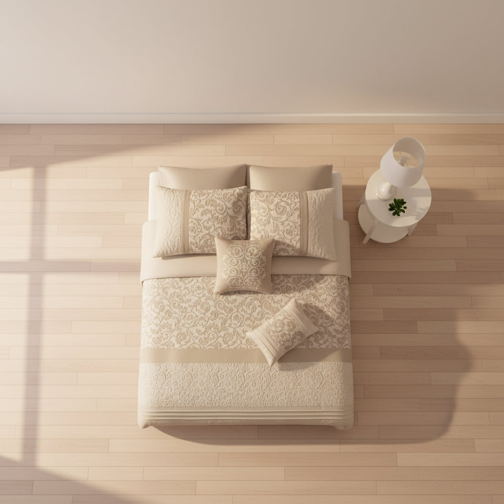 Neatly arranged bed with patterned bedding on a wooden floor.