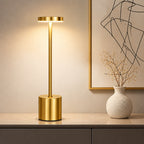 Gold table lamp with 3 color temperature dimming options on a neutral background