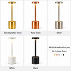 Various color options of a standing lamp including electroplated gold, rose gold, silver, white, and black.