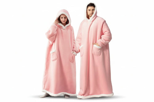 Two people wearing pink hooded blankets on a white background