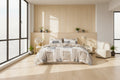 Bed with patchwork duvet cover in a bedroom setting with plants and furniture.