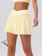 Sleeveless V-Neck Crop Top and Pleated Skirt Active Set